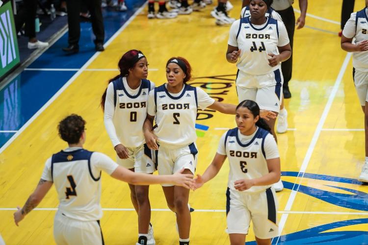 Twin women's basketball players on the court